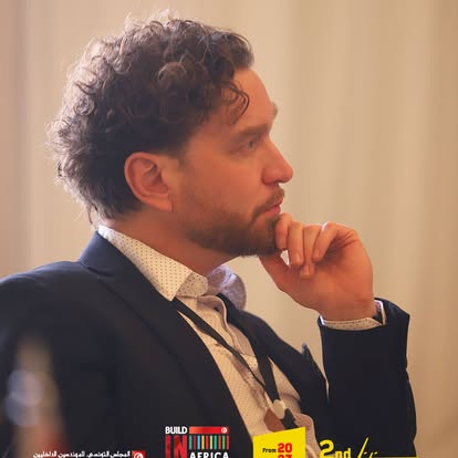 A delegate listening to the discussion at Build in Africa.